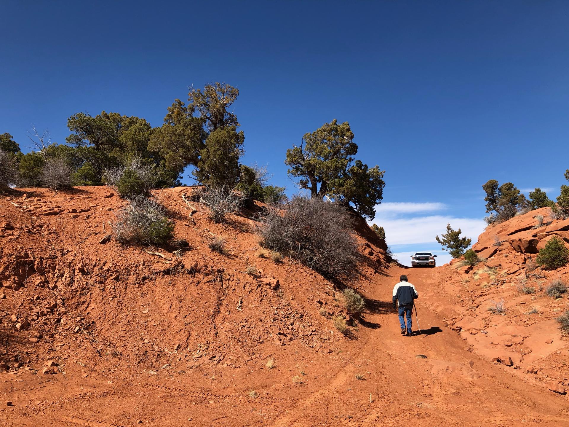 landscape near Cove, AZ, with Timothy Benally walking up to his truck